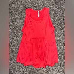 Super soft tank top- isn’t as bright as the picture.